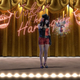 Harley Quinn and a floating character on stage.